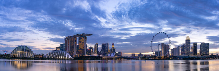 Wide panorama image of Singapore skyline at dusk	
