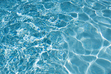 Tansparent clear calm water surface texture. Abstract nature background. Sea water pattern.