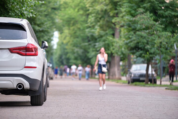 Close up of a car parked illegally against traffic rules on pedestrian city street side