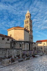 Fototapeta na wymiar Diocletian's Palace and bell tower from old stone street in the old town of Split, Croatia. 