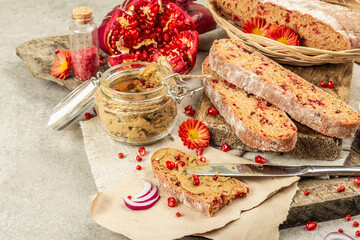 Fresh homemade chicken liver pate or paste in a glass jar with baguette slices on the serving board