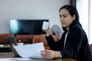 Portrait of Asia women drinking hot coffee in the office