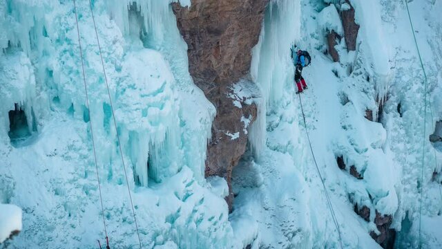 Time Lapse of Ice Climbers Climbing on Frozen Waterfall on Cold Winter Day in Mountains of Colorado, Ouray USA