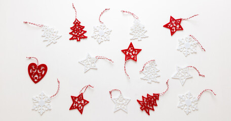 Xmas red and white trees snowflakes stars and a lonely heart on white background top view.