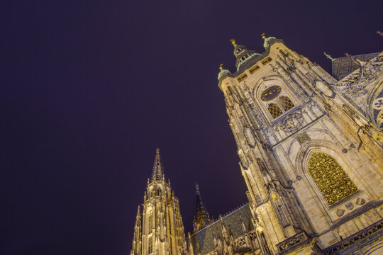 Cathedral with a clock rising into the night sky