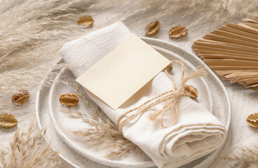 Table place with Blank paper card and bohemian decorations