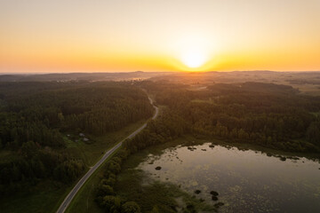Aerial summer morning sunrise view in sunny Elektrenai lake, Lithuania