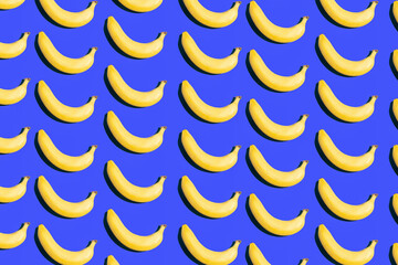 Pattern of ripe yellow bananas on a blue background