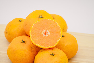 Tangerines on the wooden board.