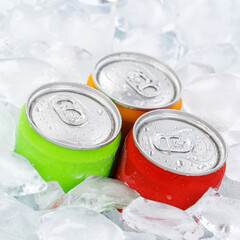 Drinks lemonade cola drink softdrinks in cans with ice cubes square