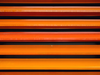 Orange metal striped wall. Abstract background