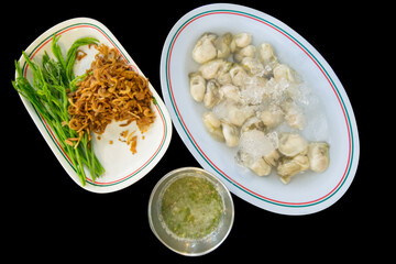 Die cut of fresh Oyster and vegetable, on black isolated