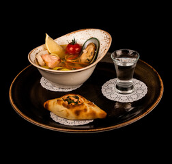 seafood soup with bread and vodka © Sergey