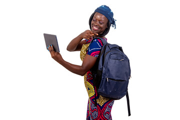 young student girl having a video call on a digital tablet and showing her backpack.