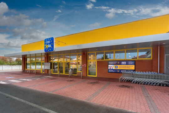 Fossano, Italy - October 24, 2021: Eurospin discount supermarket against the blue sky with white clouds. It is an Italian company in the large-scale distribution of the discount channel