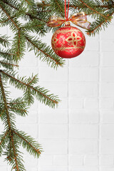 Branches of fir tree with Christmas ornament