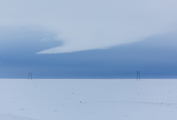 electricity mast in the snow