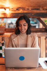 freelance indian young woman working with laptop