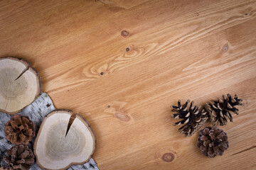 wooden background with pine cones, autumn