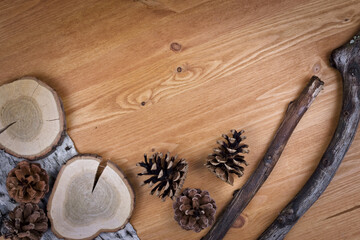 wooden background with pine cones, autumn