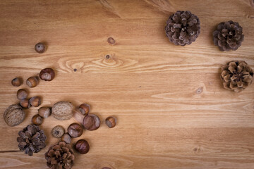 wooden background with pine cones, autumn