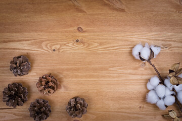 wooden background with pine cones, autumn