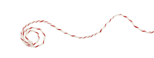 Curled white and red Christmas wrapping rope in a line arrangement isolated on white