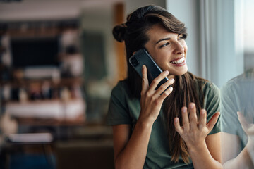 Interesting young woman, using her new phone