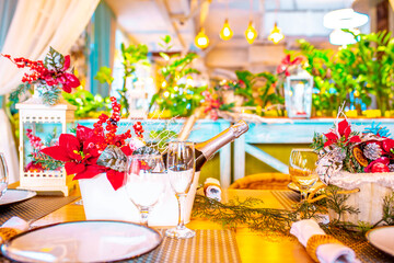 Christmas table. Festive table setting for New Year's dinner. Beautiful decoration in the restaurant awaiting guests.