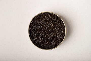 Black caviar in a metal jar - obrazy, fototapety, plakaty