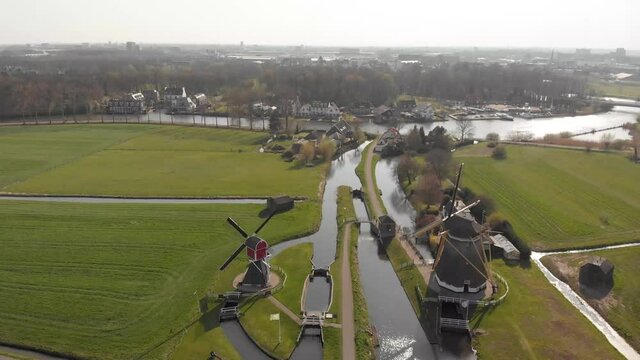 Drone shot of a typical landscape in Holland with windmills