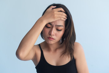sick asian woman suffering from migraine headache