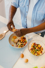 Cropped picture of African man preparing healthy lunch.