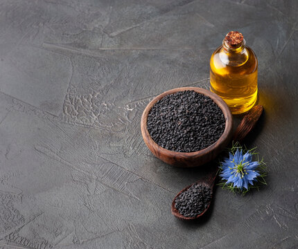 Glass bottle of black cumin seeds