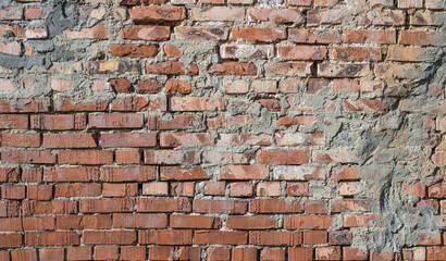 The facade of an old building. Texture of red brick wall background.