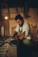 Fototapeta na wymiar Male joiner at the workplace. High quality photo