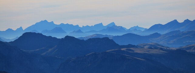 Fototapeta na wymiar Outlines of mountain ranges seen from Mount Niesen, Switzerland.