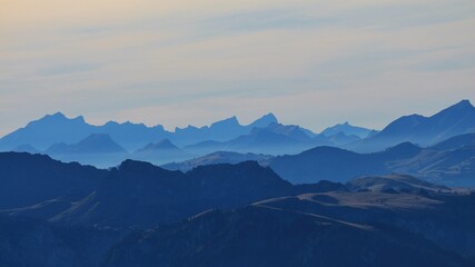 Blue silhouettes of mountains in the Bernese Oberland.