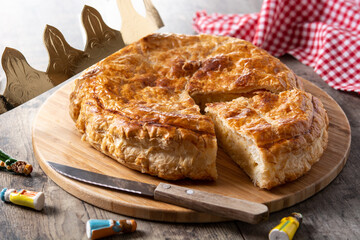 Galette des rois on wooden table. Traditional Epiphany cake in France	