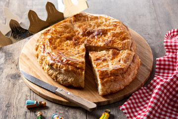 Galette des rois on wooden table. Traditional Epiphany cake in France	