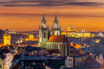 Fototapeta premium Prague cityscape at sunset with church of Our Lady before Tyn and Prague castle at background, Czech Republic