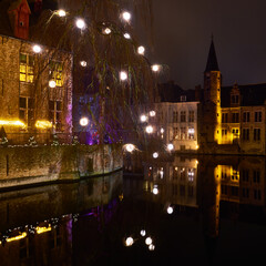 Christmas in Bruges, Belgium. The historic center of the Belgian city in the New Year's illumination. Travel through the romantic cities of Europe