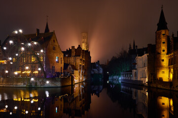 Fototapeta na wymiar Christmas in Bruges, Belgium. Romantic city in the evening fog. Travel and tourism in Europe