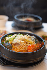 Korean seafood ttukbaeg. Abalone earthen pot stew.