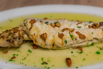 Cod with pil pil sauce traditional Basque dish in a restaurant in Pamplona Spain