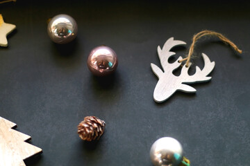 Various Christmas ornaments on dark background. Selective focus.