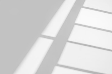 Gray window shadow and light blur abstract background on white wall, shadow overlay effect