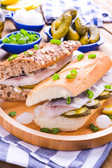 Dutch herring. Toast with Dutch herring, onions, pickles. Traditional rustic appetizer with seafood. Popular food in the netherlands. 