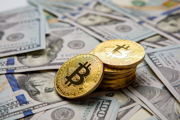 golden bitcoin coin on us dollars close up. Electronic crypto currency