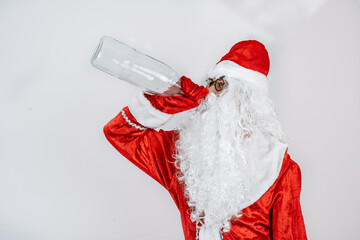 Santa Claus with a bottle of Alcohol enjoying a drink and taking a rest